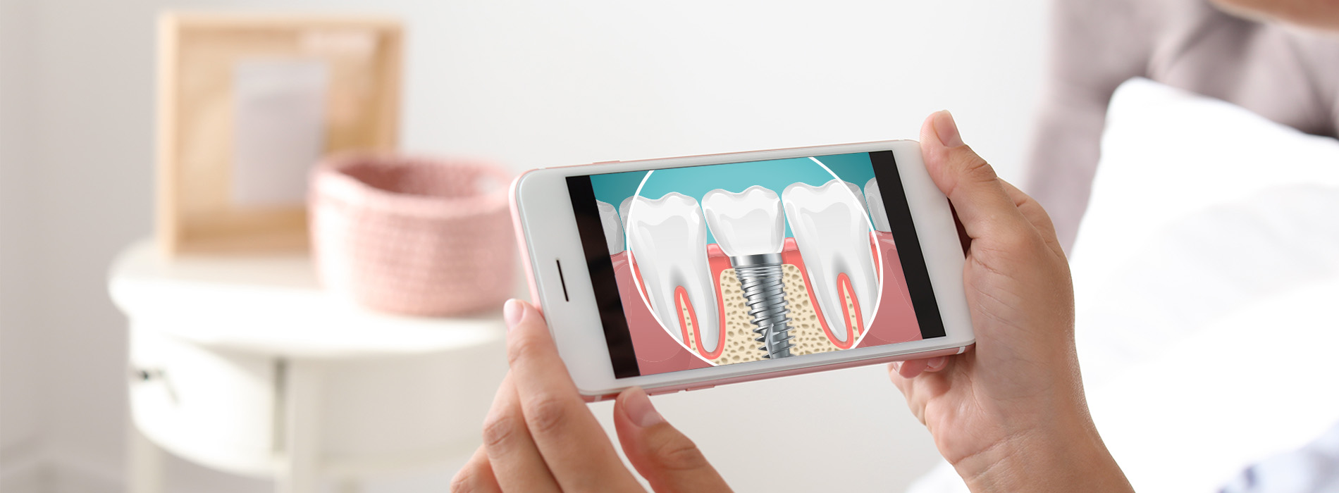 A person holding a smartphone displaying an animated toothbrush with toothpaste, set against a blurred background with a hint of domestic interior.